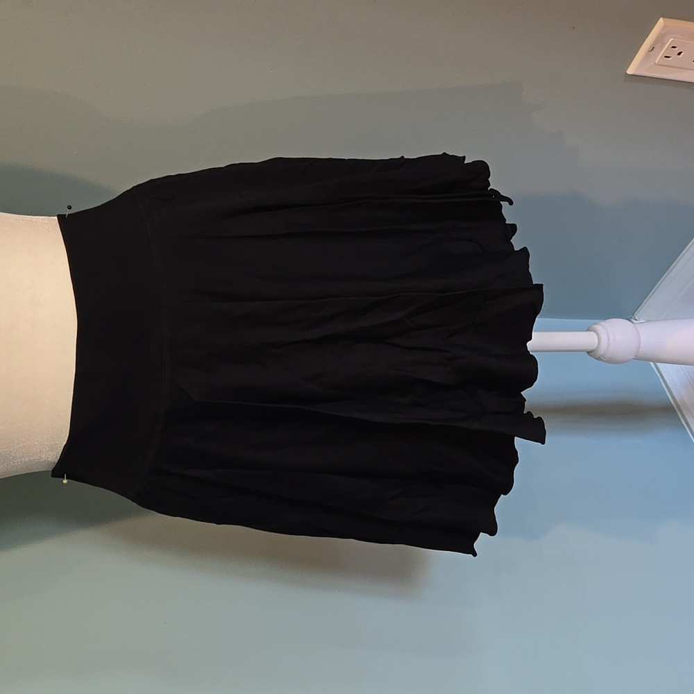 Black flowy skirt with built in shorts (see picture) Size Large. NEVER WORN